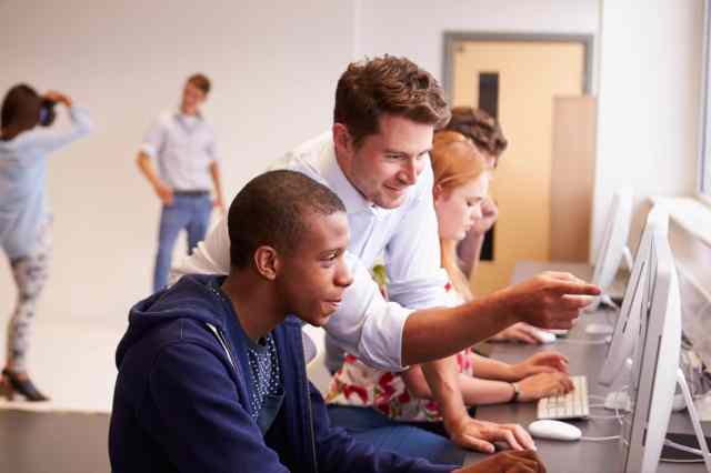College Students Using Computers On Media Studies Course stock photo
