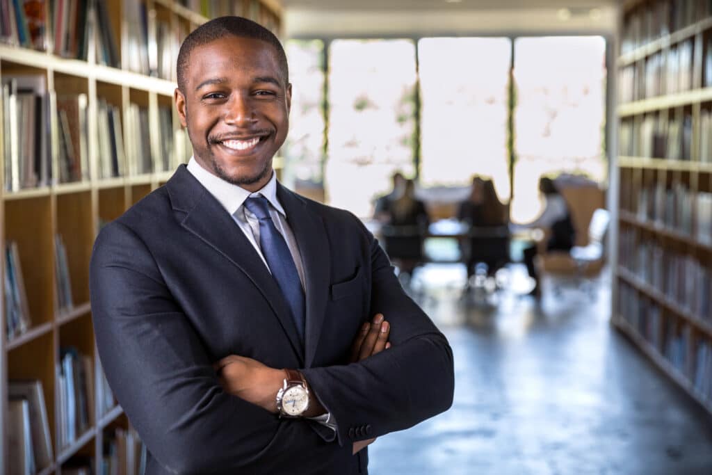 Smiling man with arms crossed